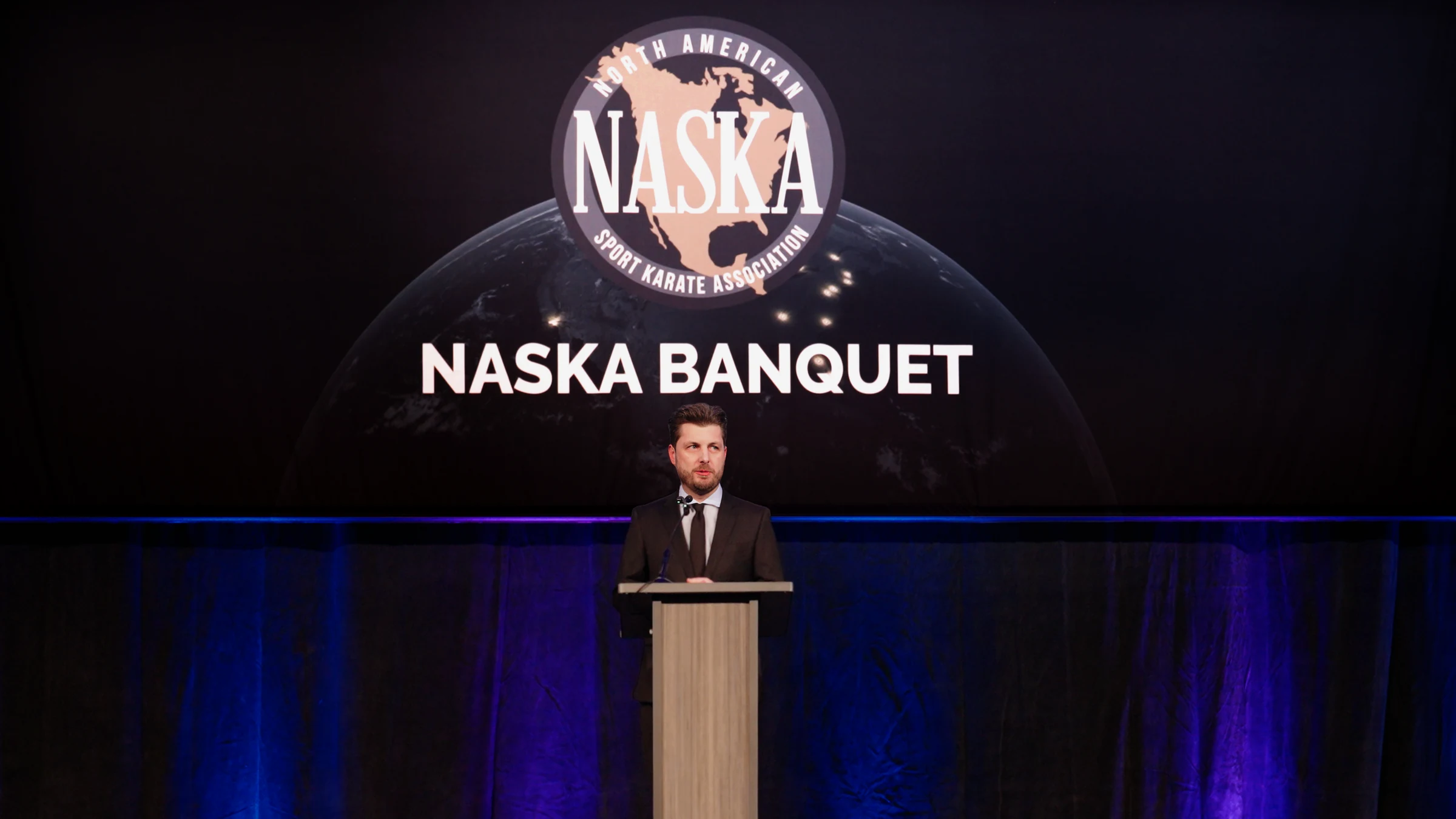 Hunter speaking at the NASKA awards banquet