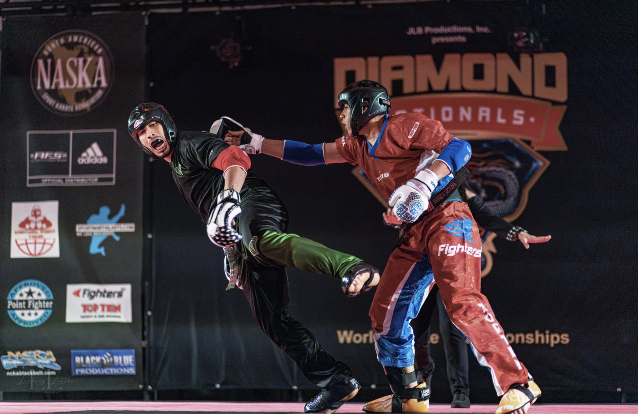 Two competitors sparring on stage at Diamond Nationals
